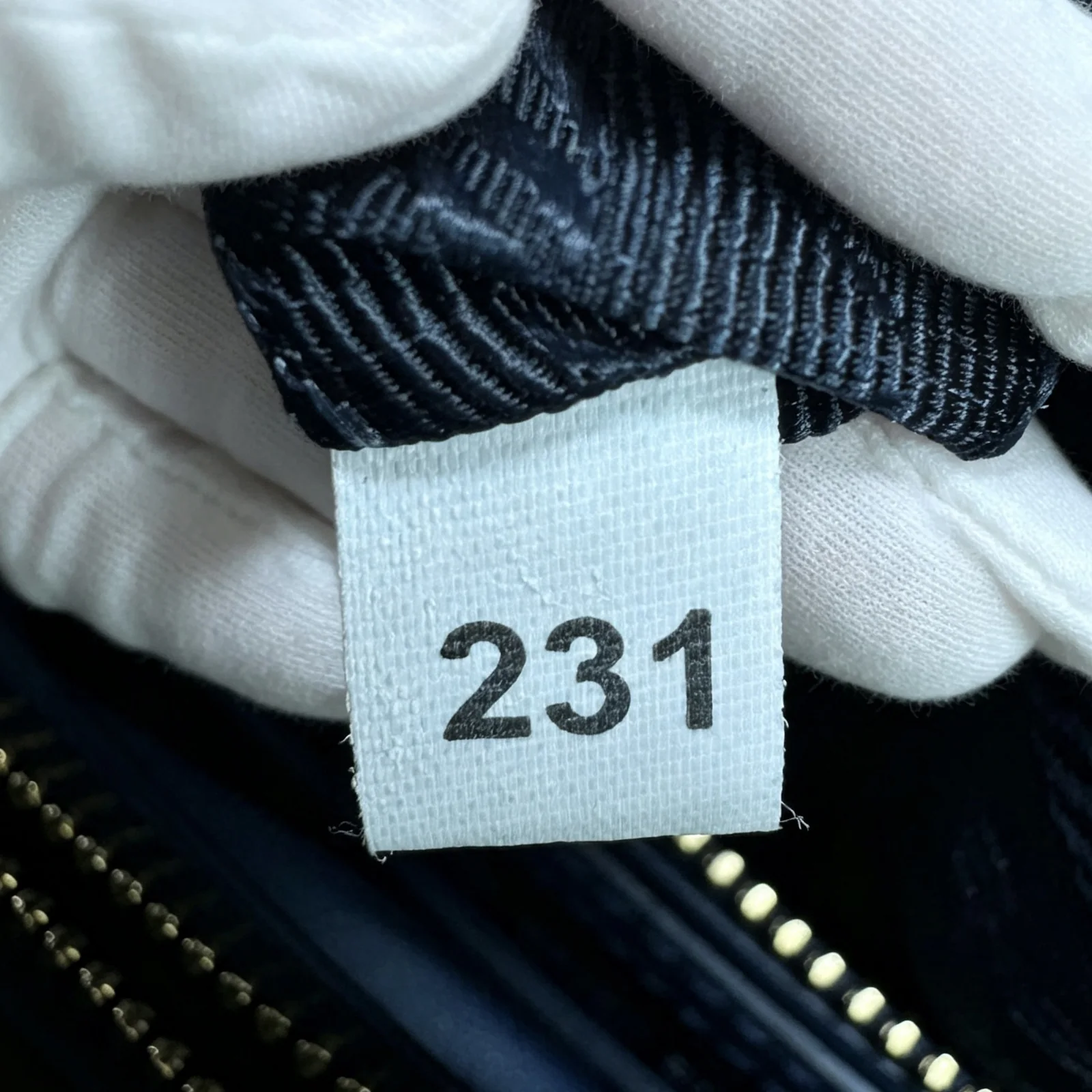 Prada Serial Number Checker — White fabric-tag number
